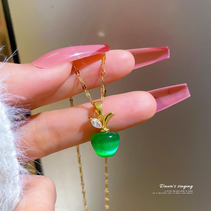 

Titanium Steel Cat s Eye Stone & Diamond-Studded Apple Necklace