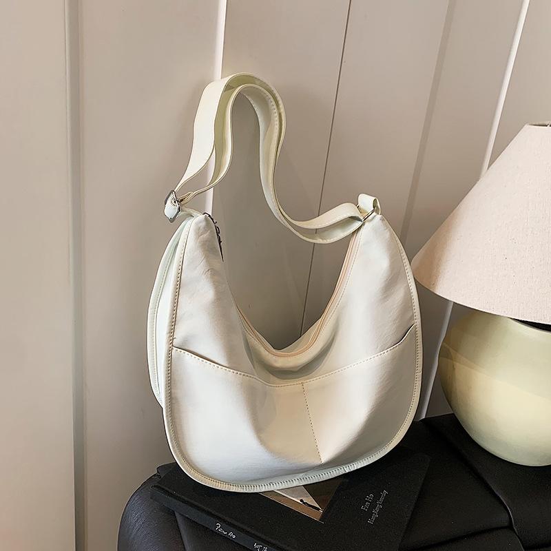 Canvas bag women's large-capacity new niche design sense summer shoulder messenger bag versatile commuter dumpling bag