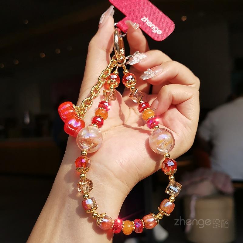 

Persimmon safe crystal mobile phone hanging chain ins boutique handmade high-end women s bracelet beaded chain short wrist pendant persimmon ruyi red crystal bracelet