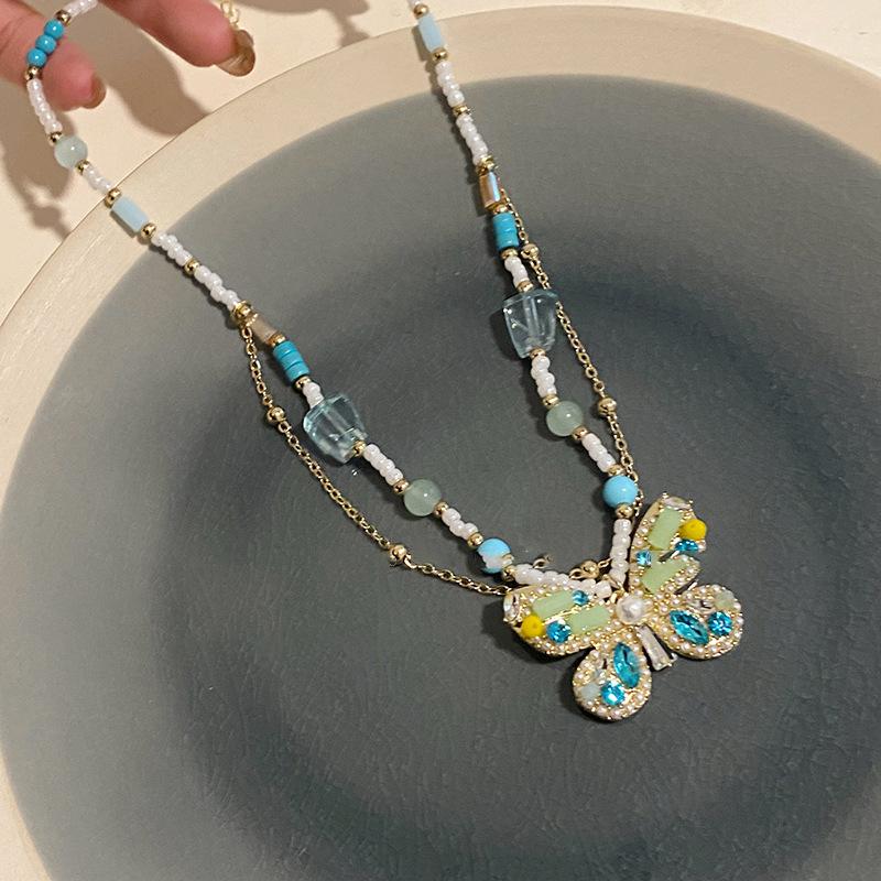 

Жемчужная инкрустация бриллиантами, ожерелье-подвеска с бусинами в виде бабочки, легкая роскошь, темперамент, высокое чувство, цепочка для ключицы, нишевая мода, универсальные украшения