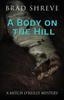 Libro A Body On The Hill 2 A Mitch Oreilly Mystery by Brad Shreve - Paperback