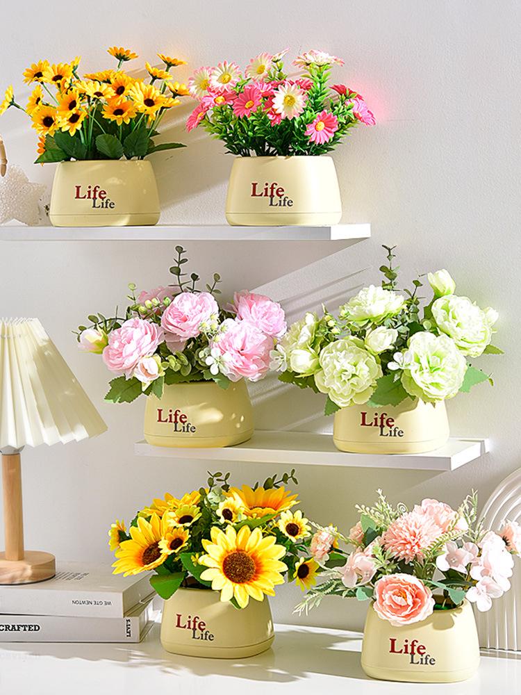 Living Room Decor: Artificial Sunflower and Green Plant Arrangements, Small Potted Plants, and Plastic Bouquets