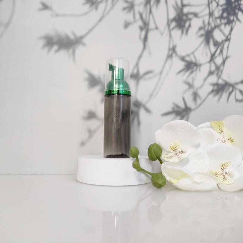 Available 60ml Transparent Black Foam Mousse Bottle for Face Wash and Travel-friendly Cosmetic Packaging.