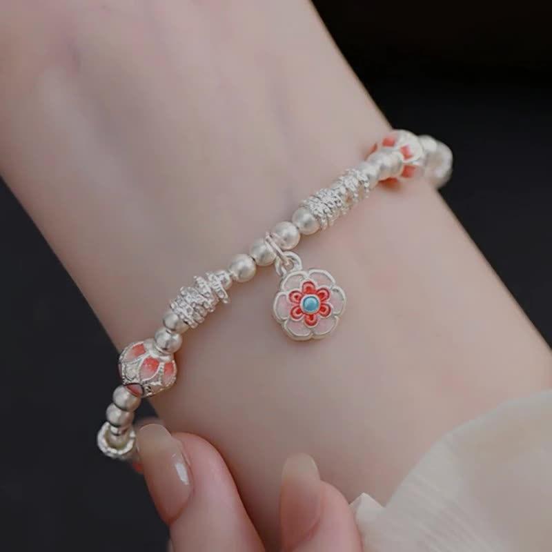 Enamel color Baoxiang flower bracelet, lucky character flower ball entanglement bracelet, light luxury high-end bracelet, fashionable and versatile