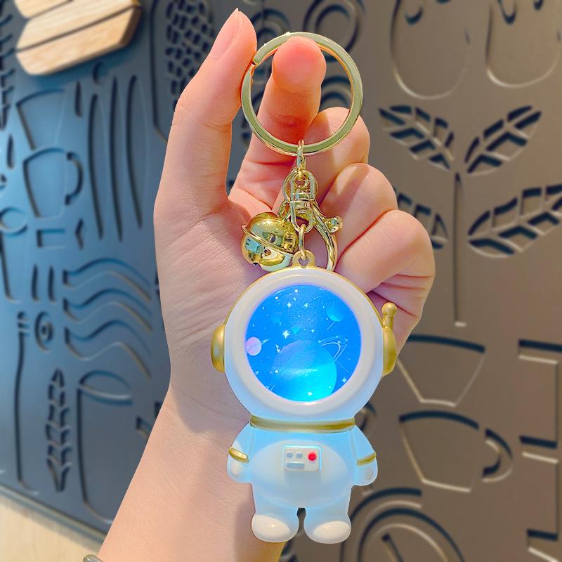 Creative Astronaut Starry Sky Keychain Pendant: Cartoon Doll Schoolbag Decoration, Perfect for Students or Couples.