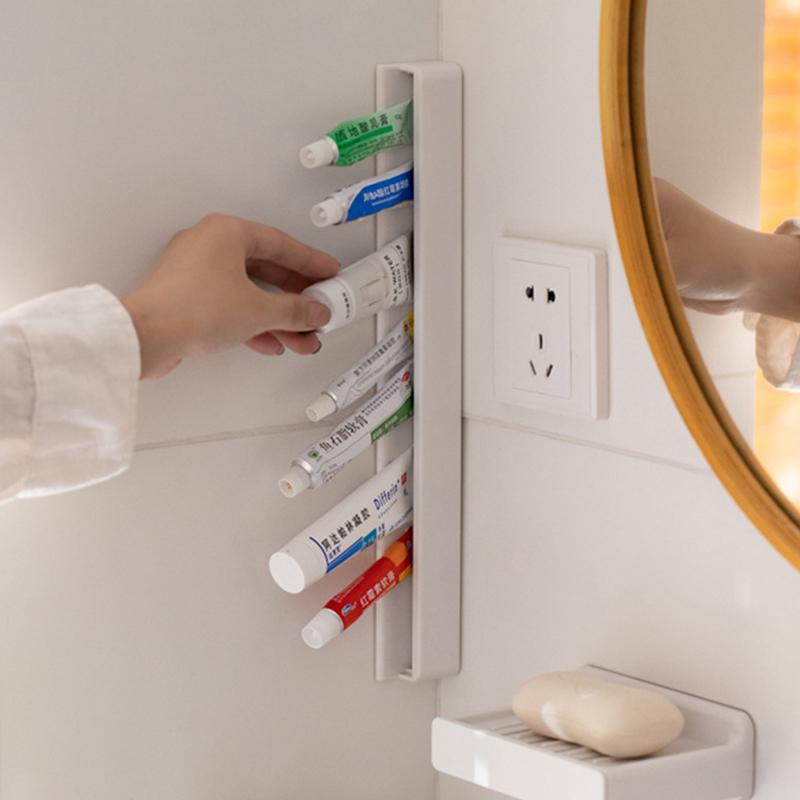 Wandmontierter Zahnpastahalter mit großer Kapazität, Badezimmer Aufbewahrungsregal ohne Bohren Selbstklebend Manueller Quetscher Hänger