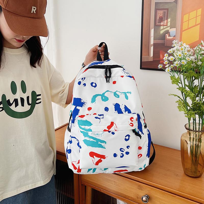 Schultasche Lässige Graffiti-Schultasche Neue koreanische Version für Herren ins Style vielseitiger Rucksack für Grundschüler Mittelschüler Harajuku