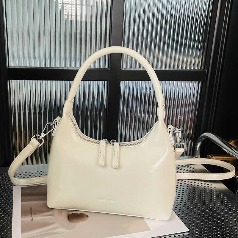 New Underarm Bag Women's Niche Portable Shoulder Bag Simple Sense Fashion Casual Hand Bag Crescent Bag
