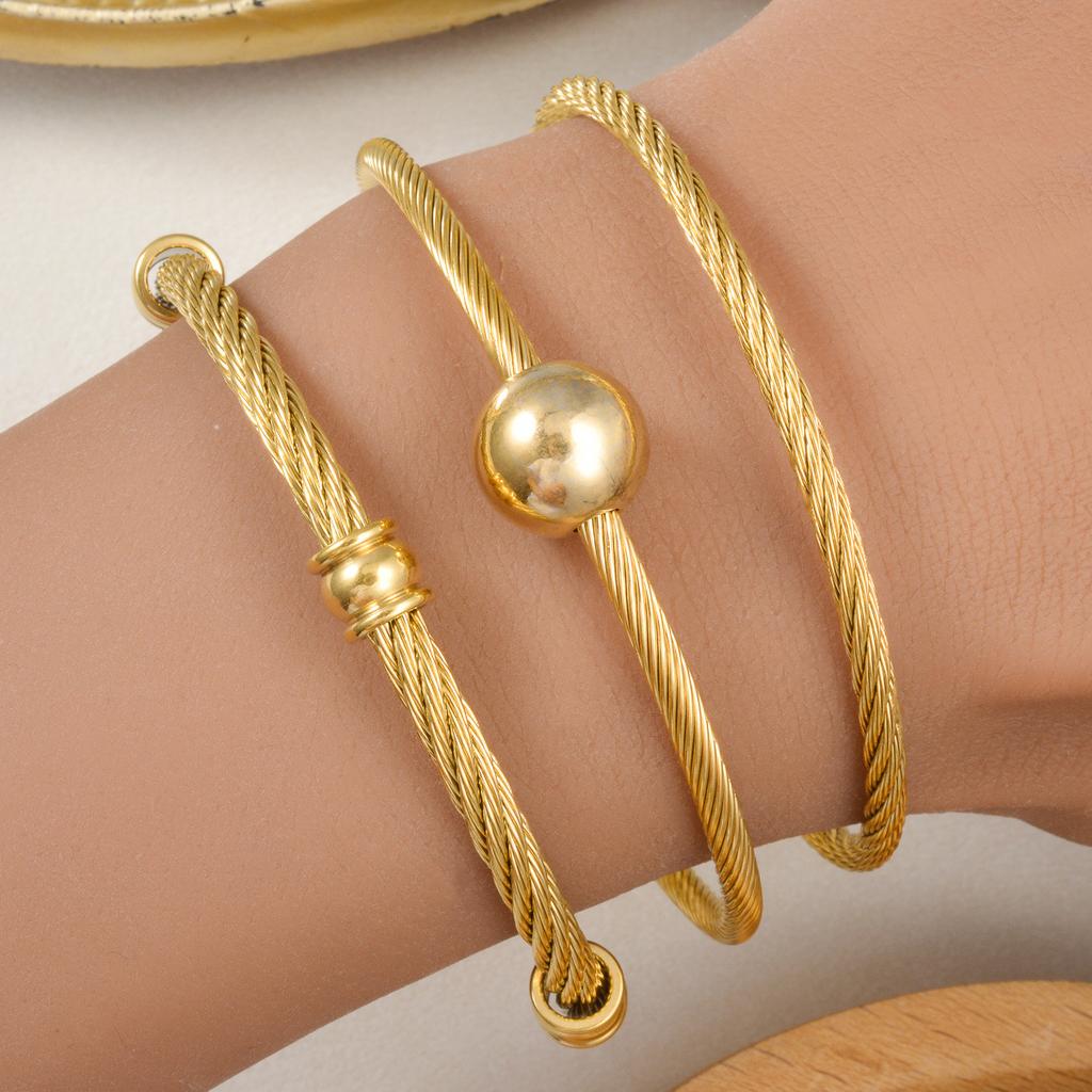 Trend European and American Personality Twist Opening Adjustable Twist Steel Wire Gold Ball Bracelet 2026