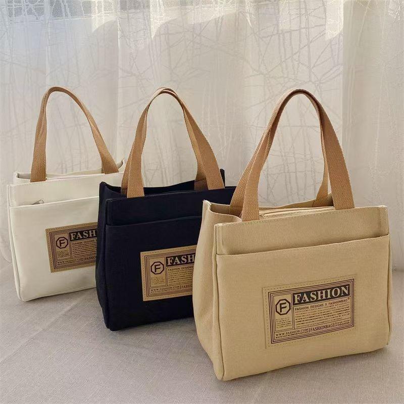 High-value canvas handbag, simple and portable for office workers, casual handbag, lunch box, and handbag.