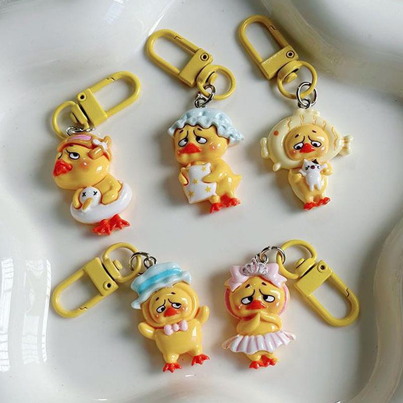 Kawaii Upsetduck Yellow Duck Resin Doll Keychain Pendant Keyring For Girls Backpack Charm Headphone Case Accessories Couple Gift