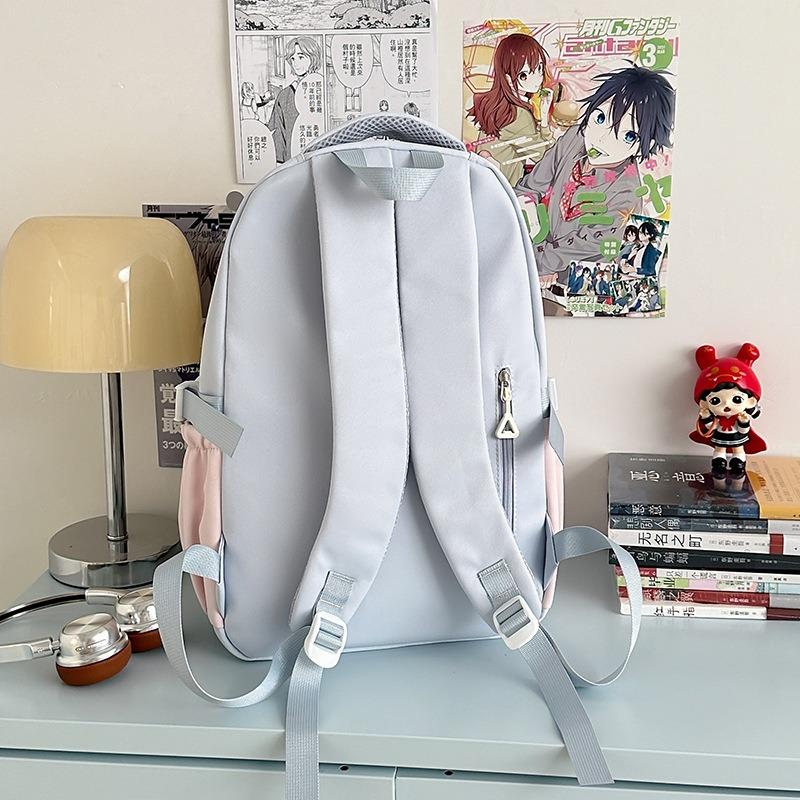 The new schoolbag is high-value, fresh and sweet, contrasting colors, splicing, and early high school students' lightweight travel backpack.