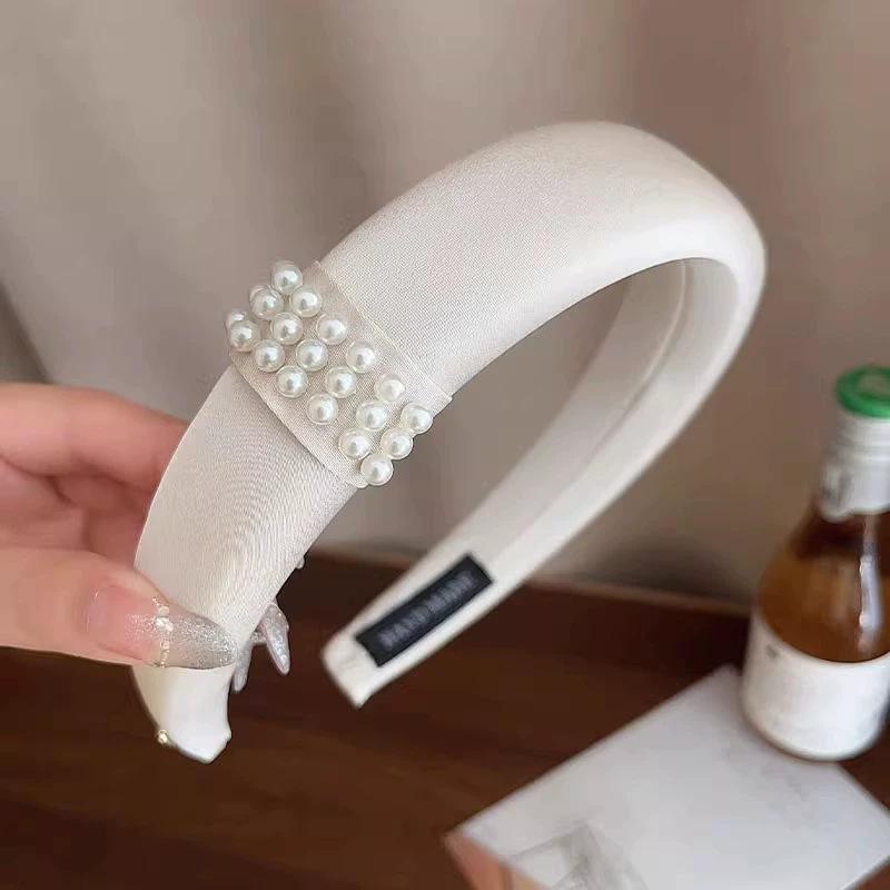 Zhao Ruth has the same black pearl headband for women's foreign light luxury headband hair jewelry.