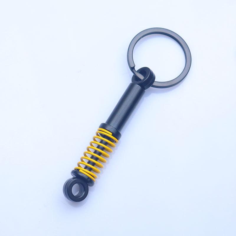 In-Stock Black Shock Absorber Keychain: Pressable Metal Spring Accessory - Perfect Small Gift