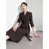 Elegant Coffee-Colored Collarless Skirt Suit for Women with Waist-Cinching Belt - Perfect for Urban Professional Style and Commuting.