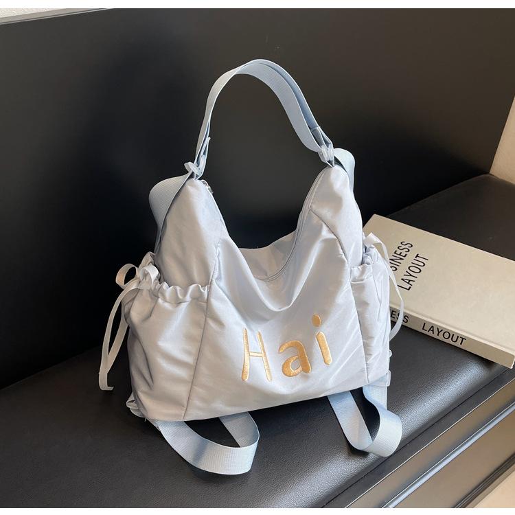 Tote bag women's 2024 new large-capacity commuting letter foreign feeling college students commute to class shoulder backpack