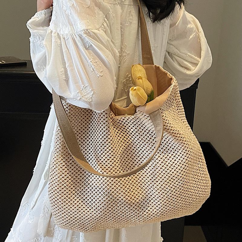 Neue Schulter Baumwollfaden Strohtasche handgefertigte hohle gewebte Tasche Urlaub Strand große Kapazität tragbare Tragetasche Frauen