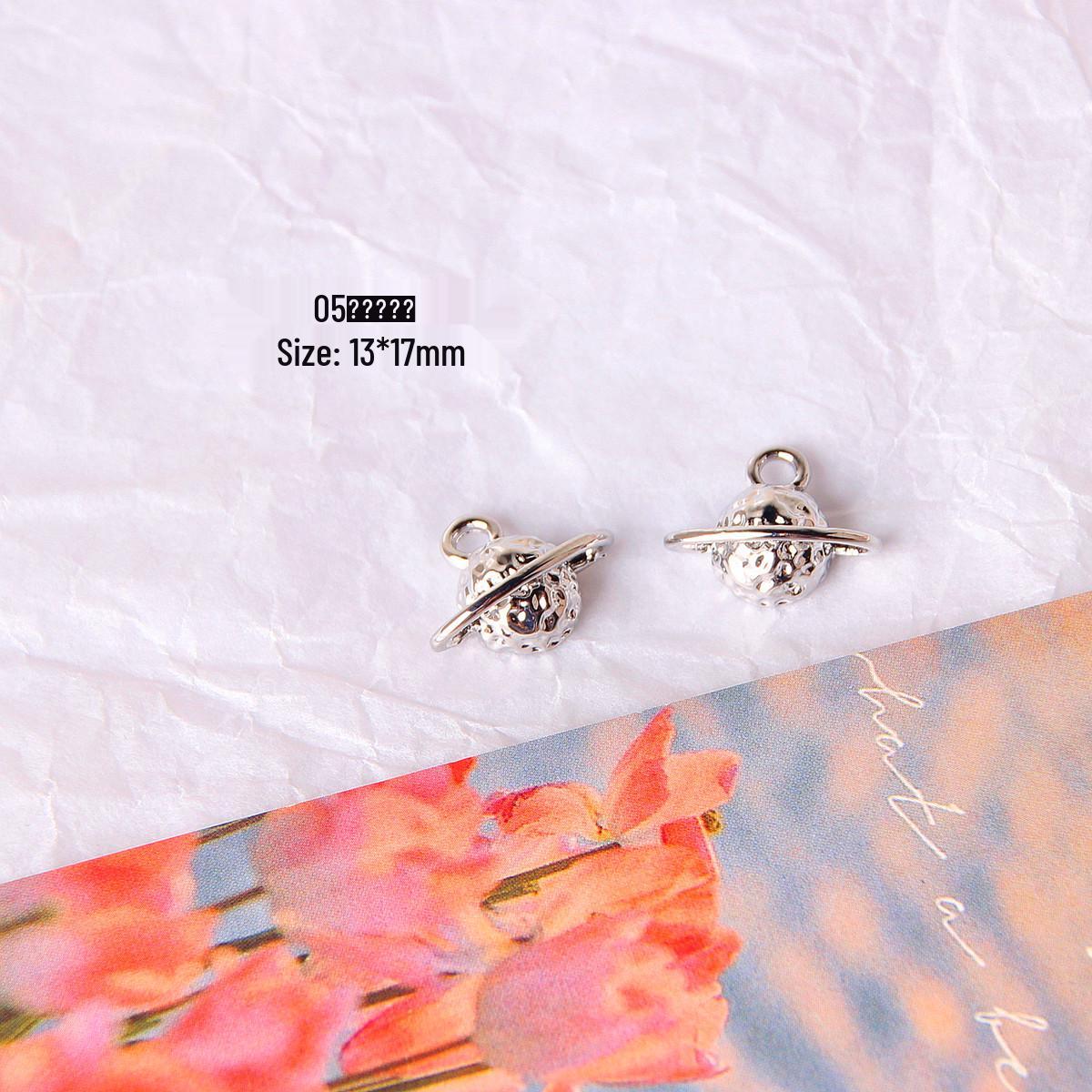 

Серьги-подвески ручной работы из серебра в виде креста, звезды и розы