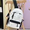 Schoolbag new high-value sweet and cute polka dot primary school backpack female volume two-dimensional transparent double shoulder pain bag