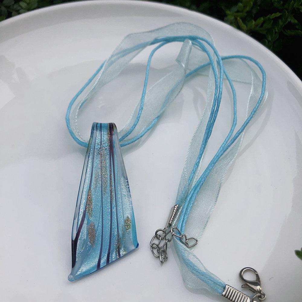 Trendy Blue Glass Ribbon Pendant Necklace & Earring Set - Perfect Seaside Vacation Accessory.