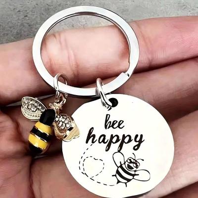 Nyckelring i rostfritt stål med gravyr "Bee Happy" Gåvotillbehör