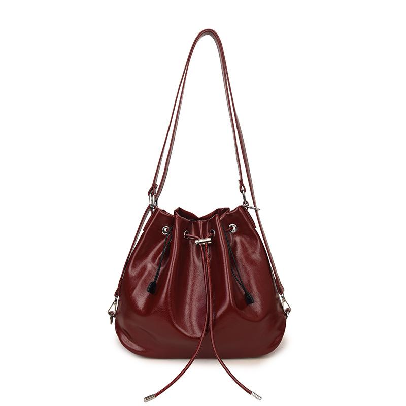 

Textured commuter retro large-capacity bag new women s backpack single shoulder bucket bag