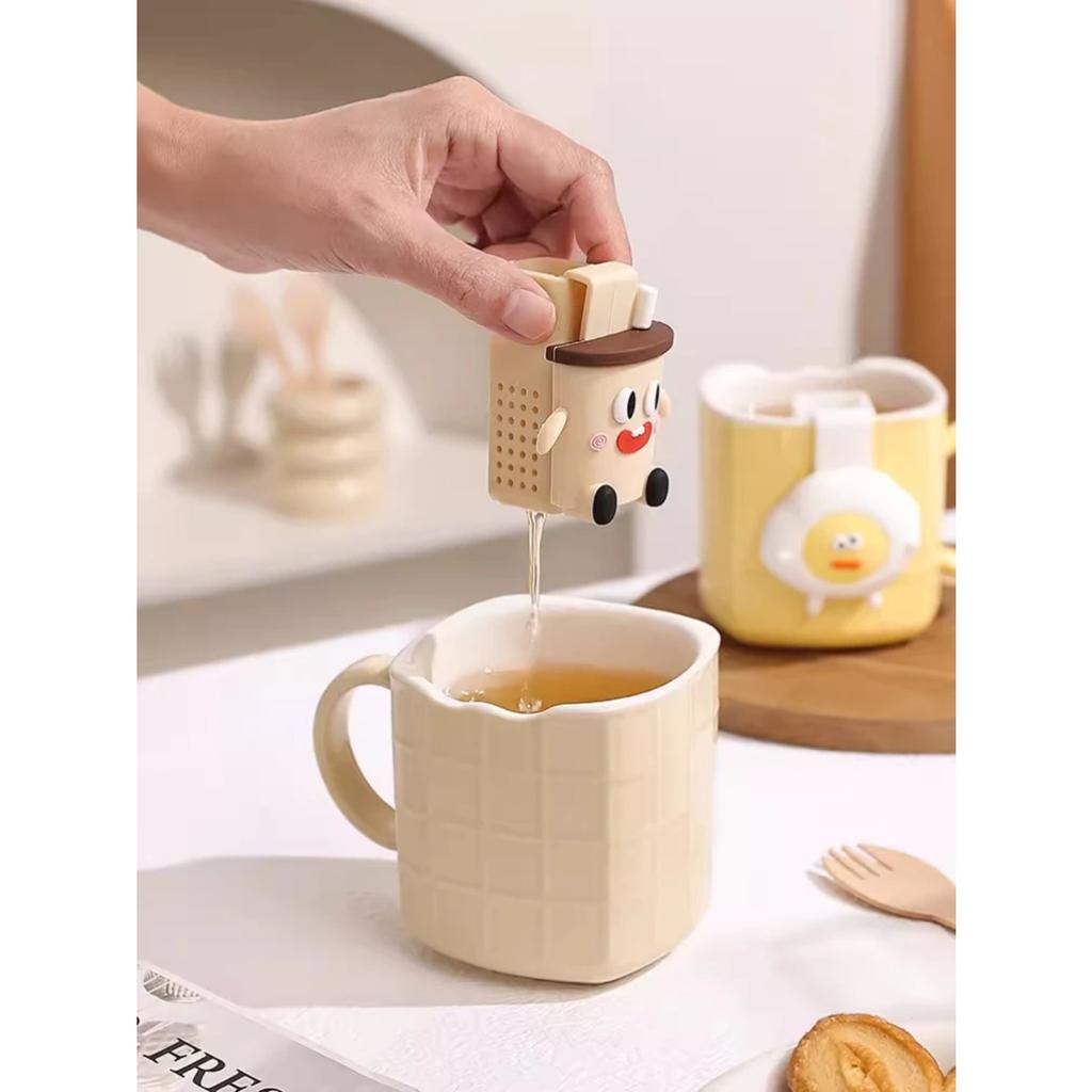 Keramiktasse mit Teesieb, hohes Erscheinungsbild, einfache Teetasse, kleine und exquisite süße Kaffeetasse im Cartoon-Stil für den Haushalt