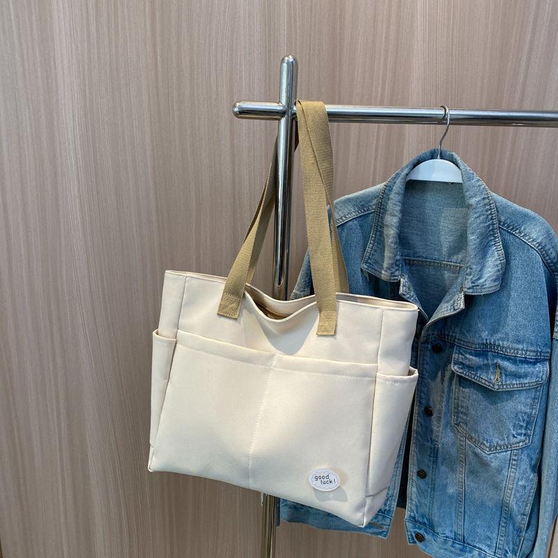 Large capacity lazy wind canvas bag women's solid color niche shoulder handbag casual versatile commuter tote bag