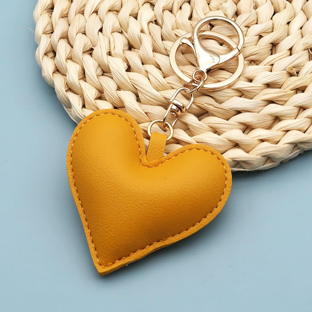 Spot wholesale PU simple peach heart bag pendant Xiaohongshu explosive love couple pendant keychain bag lanyard