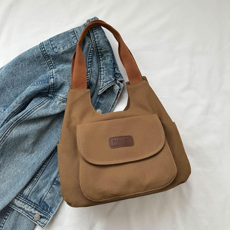 

Trendy Retro Canvas Tote Bag For Women Featuring Spacious Design And Durable Material коричневий