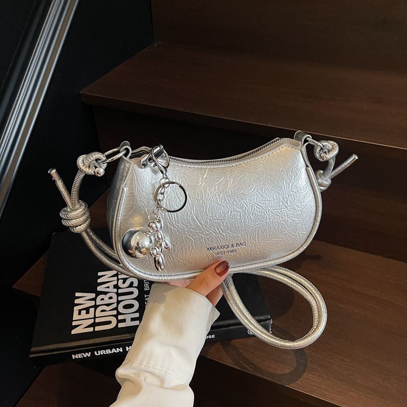 

Summer Silver Super Hot Underarm Saddle Bag Women s 2025 New Light Luxury Niche High-Grade Shoulder Messenger Bag Silver + pendant