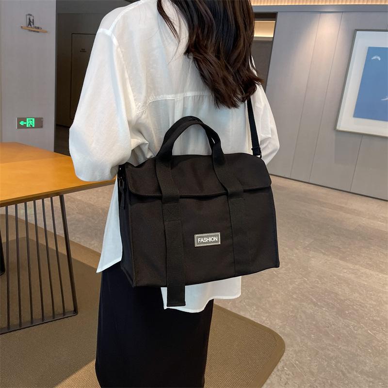 Light handbag bag women's new 2025 popular large-capacity messenger canvas bag shoulder commuter tote bag