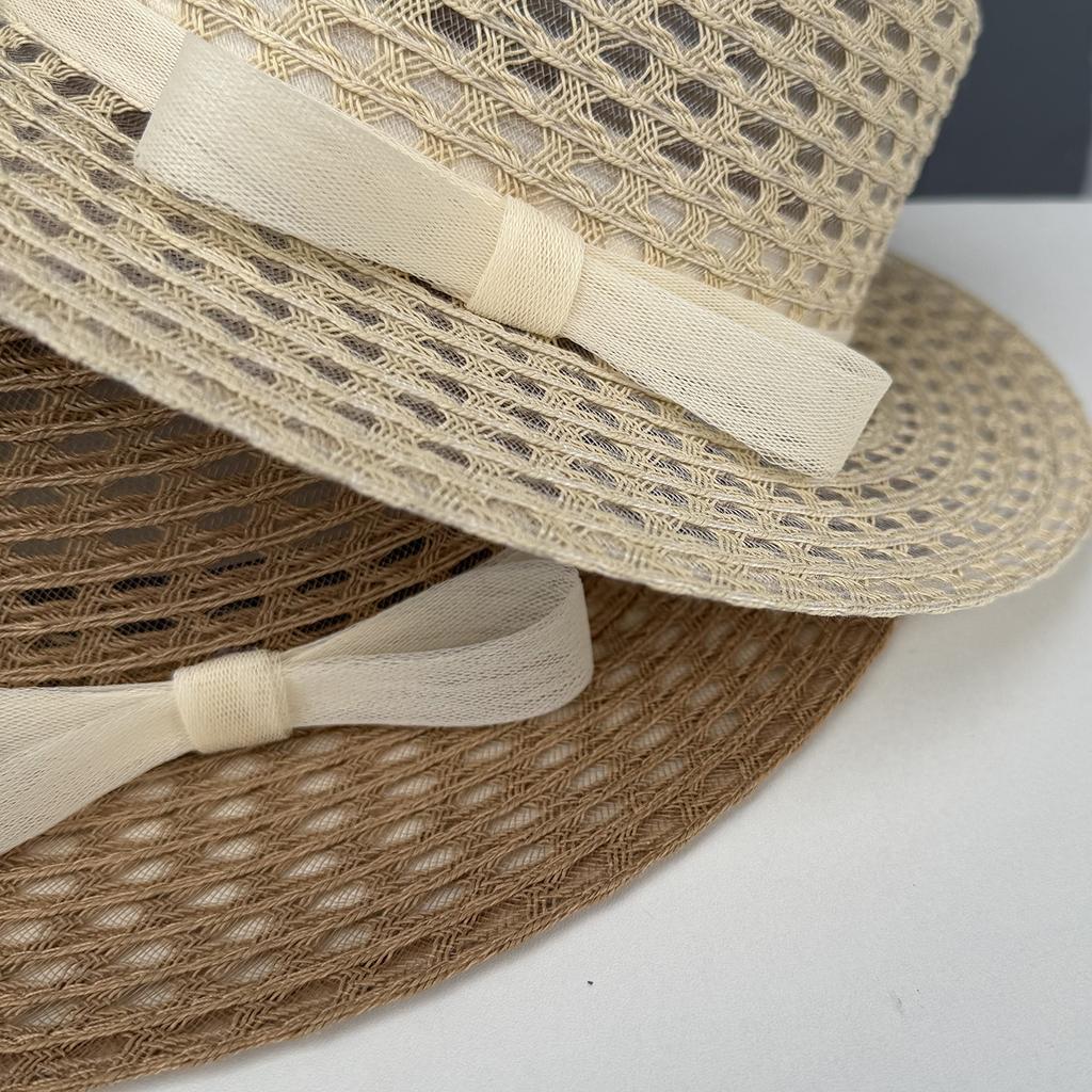 Spring and summer new hollow seaside photo hat women's beach vacation sunshade straw hat big edge flat top sunscreen top hat