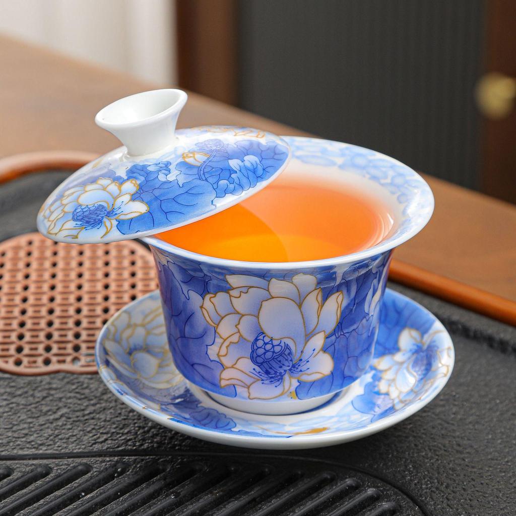 Rotating Sancai Gaiwan: Enamel Color Mutton Fat Jade Porcelain Tea Bowl with Lid for Kung Fu Tea Brewing.