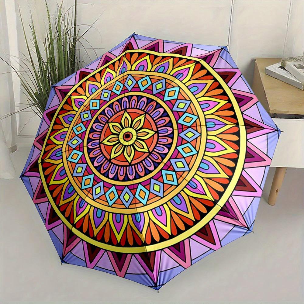 Folding Umbrella The umbrella features vibrant geometric mandala patterns with a central sunflower motif surrounded by layers
