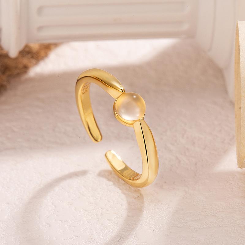 Elegant 2025 Ice-Transparent Egg-Shaped Women's Ring: Versatile, High-End Light Luxury Design with Open Gold Detail.