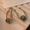 Fashion front and rear wear round bead fringed earrings light luxury high sense retro earrings fashion design earrings