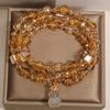 Golden Luminous Crystal Bracelet: Multi-layer Design with Chalcedony Gourd Pendant for Women, Elegant Light Luxury Style.