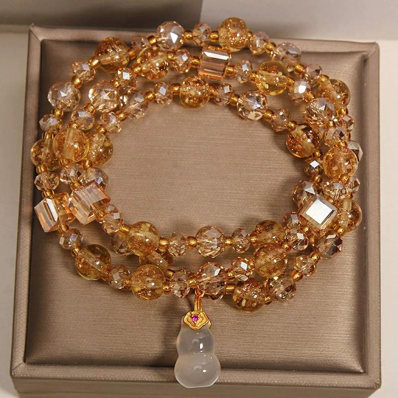 Golden Luminous Crystal Bracelet: Multi-layer Design with Chalcedony Gourd Pendant for Women, Elegant Light Luxury Style.