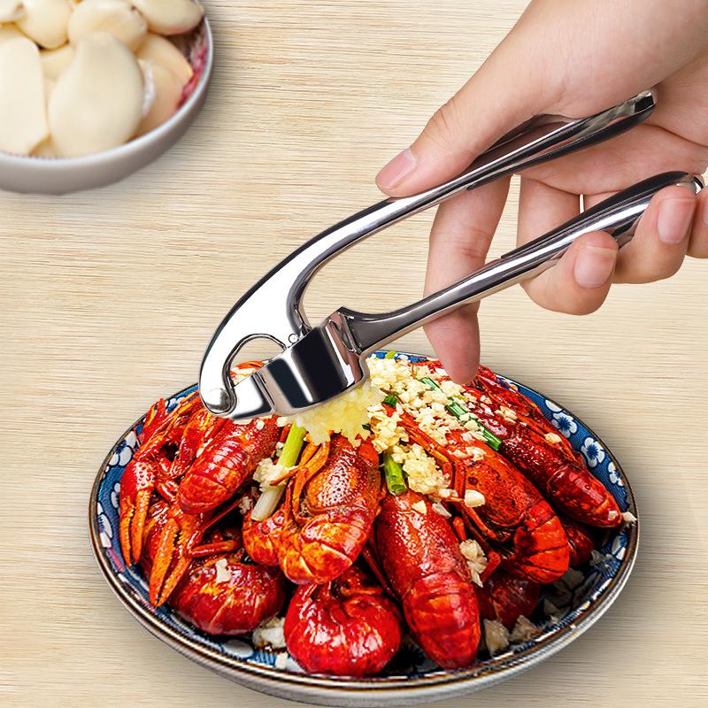 Manuell hvitløkspresse og stamper for kjøkkenbruk