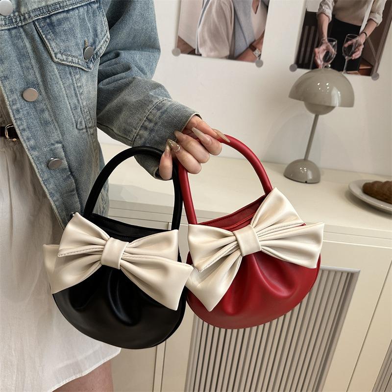 Niche design bow handbag new sense contrasting color small round bag fashionable versatile high value women