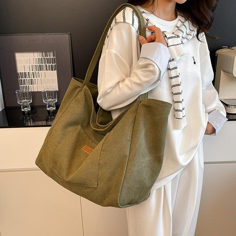 Casual large-capacity canvas bag women's bag 2025 new solid color simple tote bag fashionable shoulder armpit bag