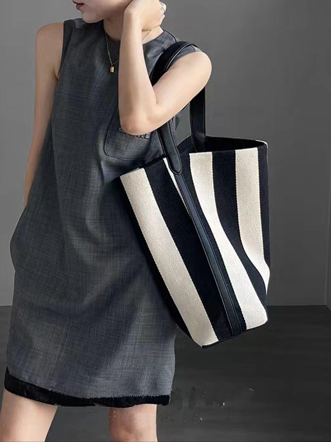 

Niche striped canvas bucket bag for women, large capacity lazy style commuting tote bag, single shoulder large bag trend