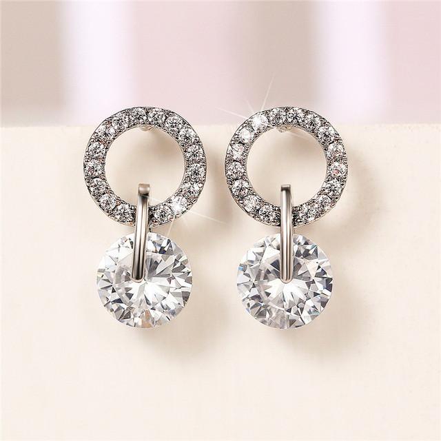 

Новые изысканные женские висячие серьги высокого качества серебряного цвета, роскошные белые циркониевые модные универсальные женские украшения