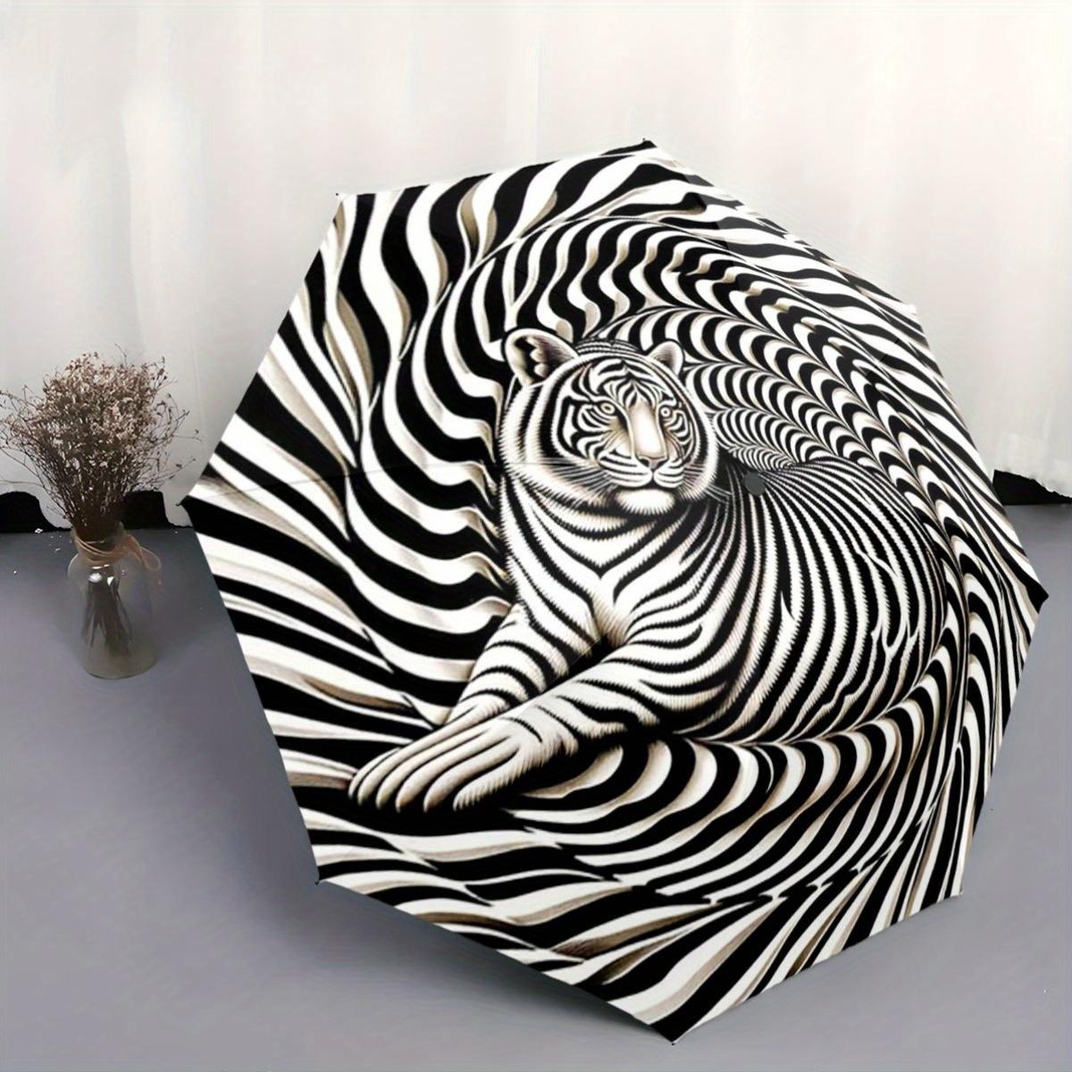 This Compact Umbrella Showcases a Striking Black And White Optical Illusion Design, Highlighted by a Large White Tiger in The