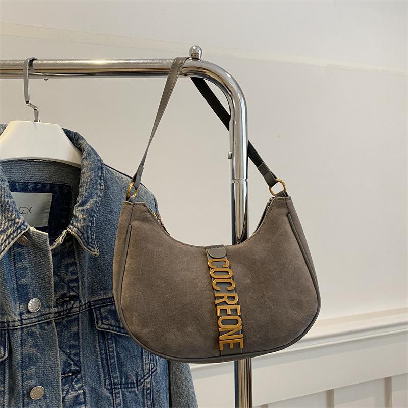 

Autumn and winter small fresh armpit small bag women s 2025 new simple texture saddle bag niche high-end shoulder bag серый