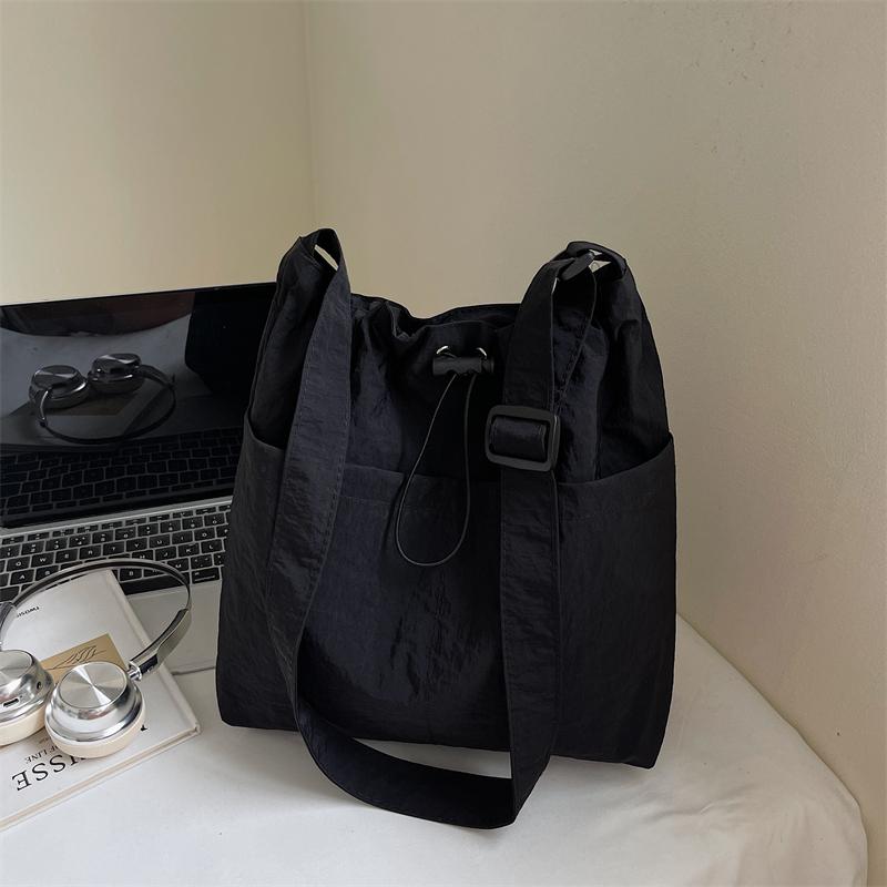 Rear zipper drawstring casual bag women's new fashion large cloth bag large capacity tote bag class commuter messenger bag