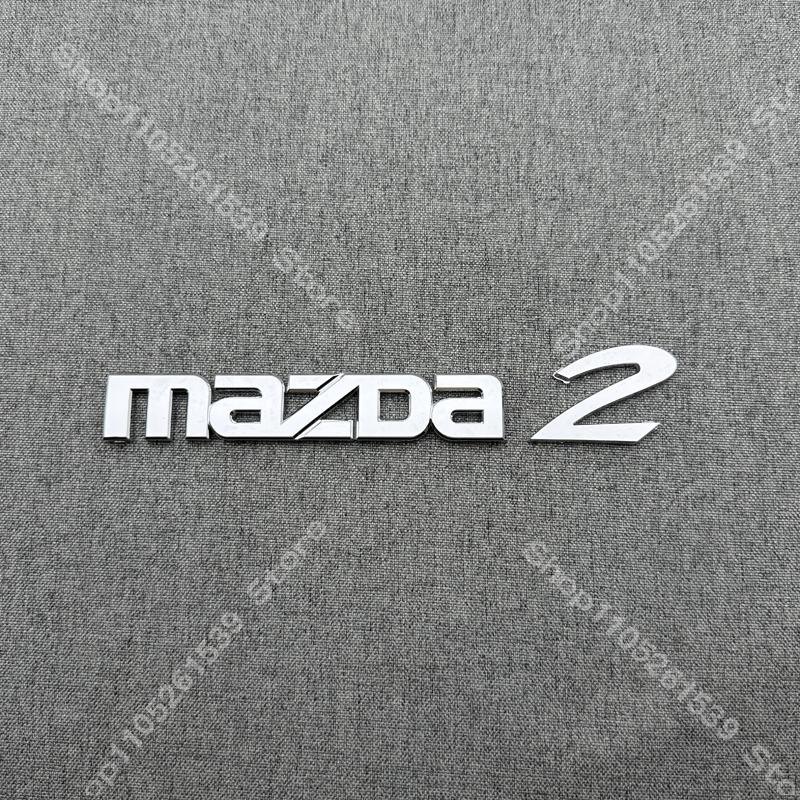 ABS Car Logo Front Grille Rear Trunk Steering Wheel Decoration Sticker For MAZDA2 2009- 2011-2015 16 17-2025 2026 MAZDA2 Emblem BBF3