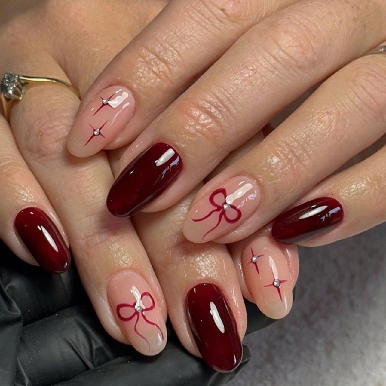 Almond-Shaped Red Press-On Nails with Bow & Star Decorations