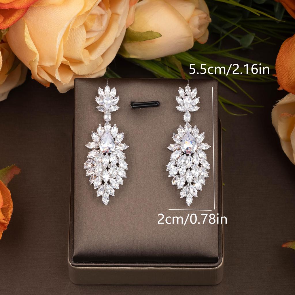 A pair of luxurious inlaid cubic zirconia marquise-shaped dangling hollow earrings suitable for women's everyday and party wear